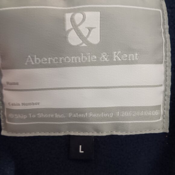 The iconic Abercrombie & Kent expedition red winter coat with blue lining. - Picture 5 of 10